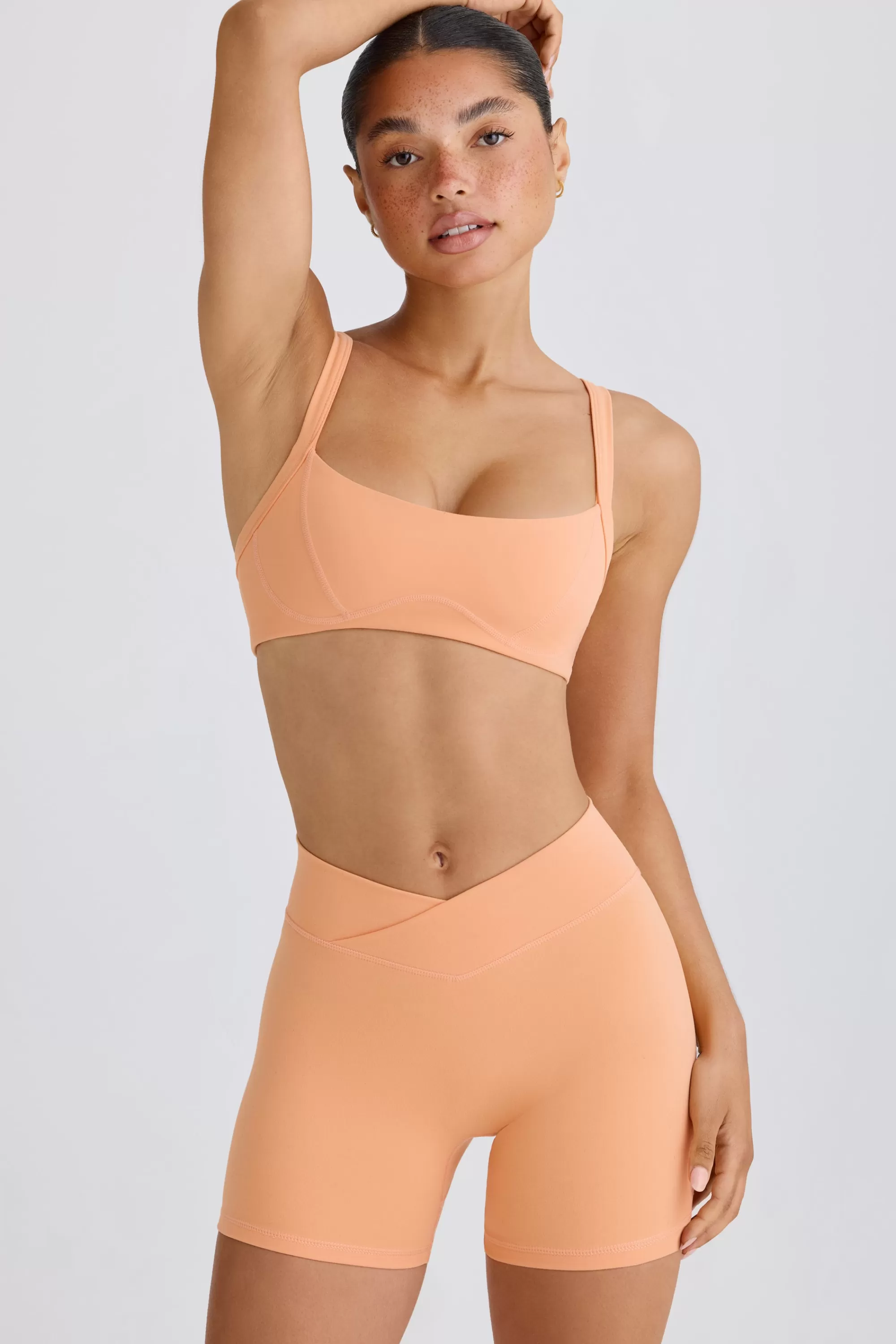 Oh Polly Soft Active Crossover Mini Shorts In Peach Peach Best Sale