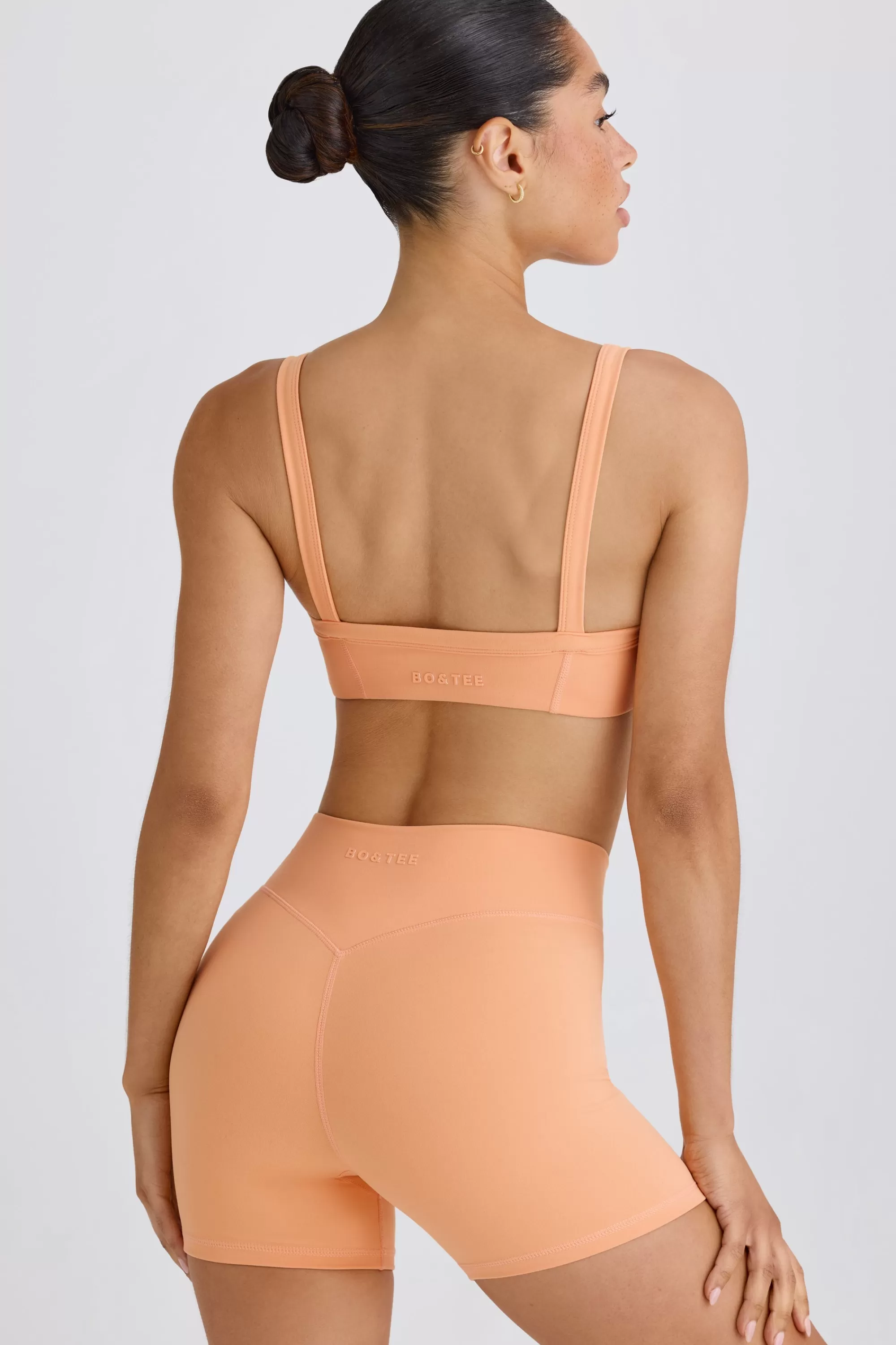 Oh Polly Soft Active Crossover Mini Shorts In Peach Peach Best Sale